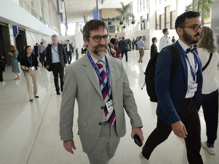 Minister of Environment and Climate Change Steven Guilbeault and other participants emerge from the main negotiations venue at the COP28 climate conference in Dubai, United Arab Emirates, on December 11, 2023.