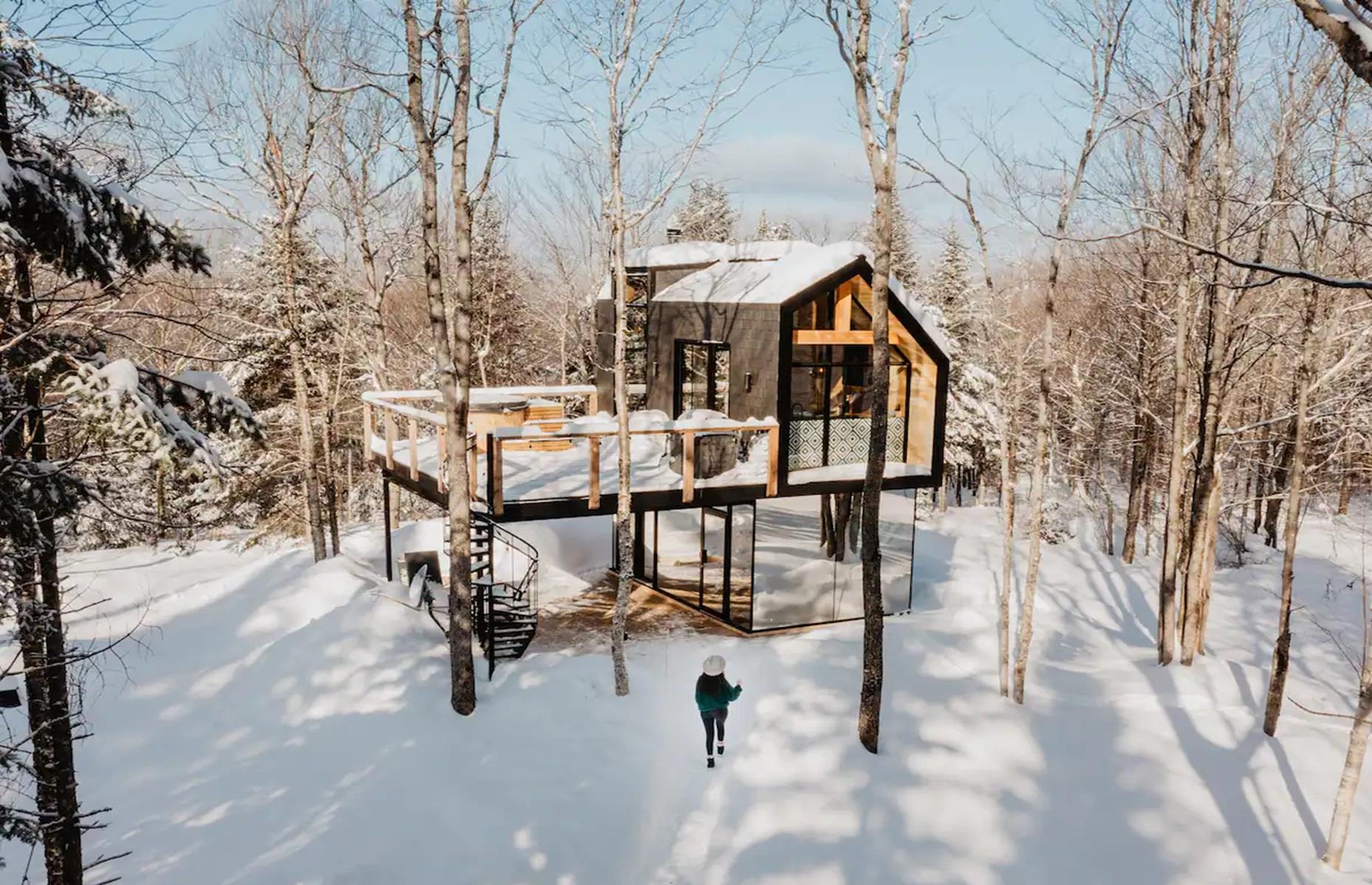 <p>Cozy, secluded, and incredibly romantic, this hygge cabin is positioned on the side of Mont-Tourbillon but, handily, is just 20 minutes from Quebec City. The cabin was designed to be a place where guests could immerse themselves in nature, recharge their batteries, practice their favorite sporting activity, and spend quality time with family or friends.</p>  <p>Akin to a modern treehouse, it features two floors – one of which is covered in mirrors to reflect the stunning surrounding landscape.</p>