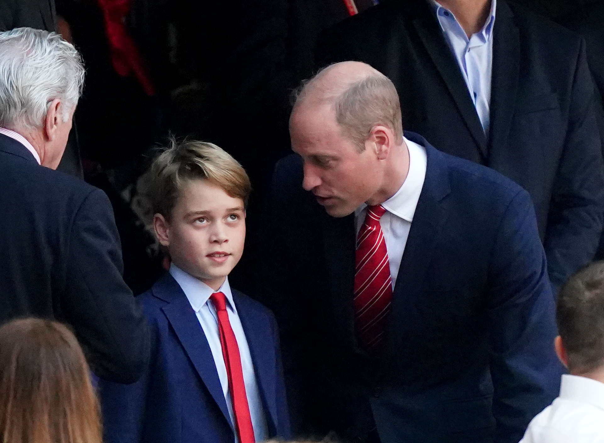 <p><span>Prince George half-tuned out his dad, <a href="https://www.wonderwall.com/celebrity/profiles/overview/prince-william-482.article">Prince William</a>, as they arrived in the stands to watch a match in the Rugby World Cup 2023 quarter final match at Stade Velodrome in Marseille, France, on Oct. 14, 2023.</span></p><p>The future kings -- wearing matching navy suits and red ties -- made the trip to France to support Wales in the quarterfinals as the team played Argentina. William is patron of the Welsh Rugby Union.</p>