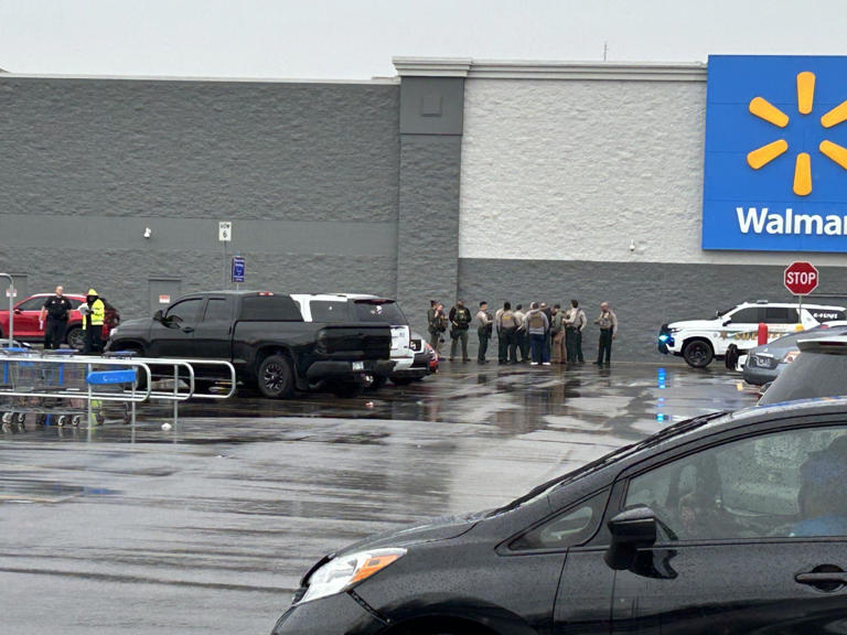 Walmart customer shot by former employee; suspect in custody