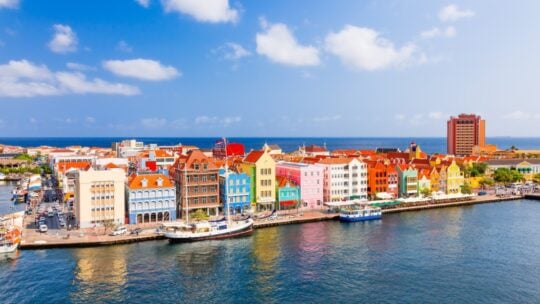 <p><span>Curacao, a lesser-known Caribbean gem, offers an affordable island paradise experience. Once a pivotal location in the Dutch slave trade, it now invites tourists to its shores with its rich history and stunning landscapes. Flights from the U.S. and Canada are reasonably priced, averaging around $360. </span></p><p><span>Visitors can enjoy luxurious yet affordable beachfront resorts for under $70 a night, minimizing the need for additional spending on activities. Beyond beach relaxation, Curacao boasts attractions like the Klein Lighthouse and the Curacao Maritime Museum, making it an enticing destination for those looking to explore beyond the typical Caribbean <a href="https://www.kindafrugal.com/12-favorite-vacation-spots-that-deserve-a-spot-on-your-bucket-list/">vacation spots</a>.</span></p>