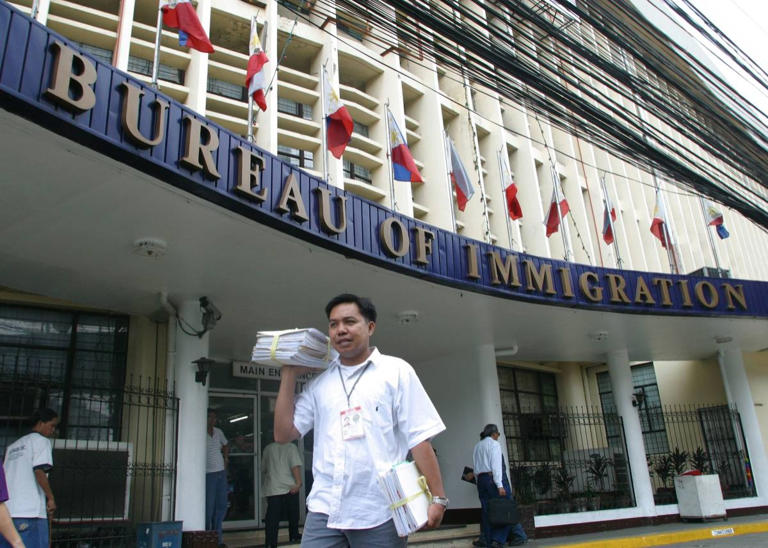 A messenger carries documents outside the Bureau of Immigration in Intramuros, Manila. Commissioner Andrea Domingo admitted that funds of the bureau to pay for water, electric and phone bills might last only until September and force a closure by October unless government increases its budget allocation. photo by Rolex dela Pena file: 28august_bid4_rolex / news 8-29 / photos today2
