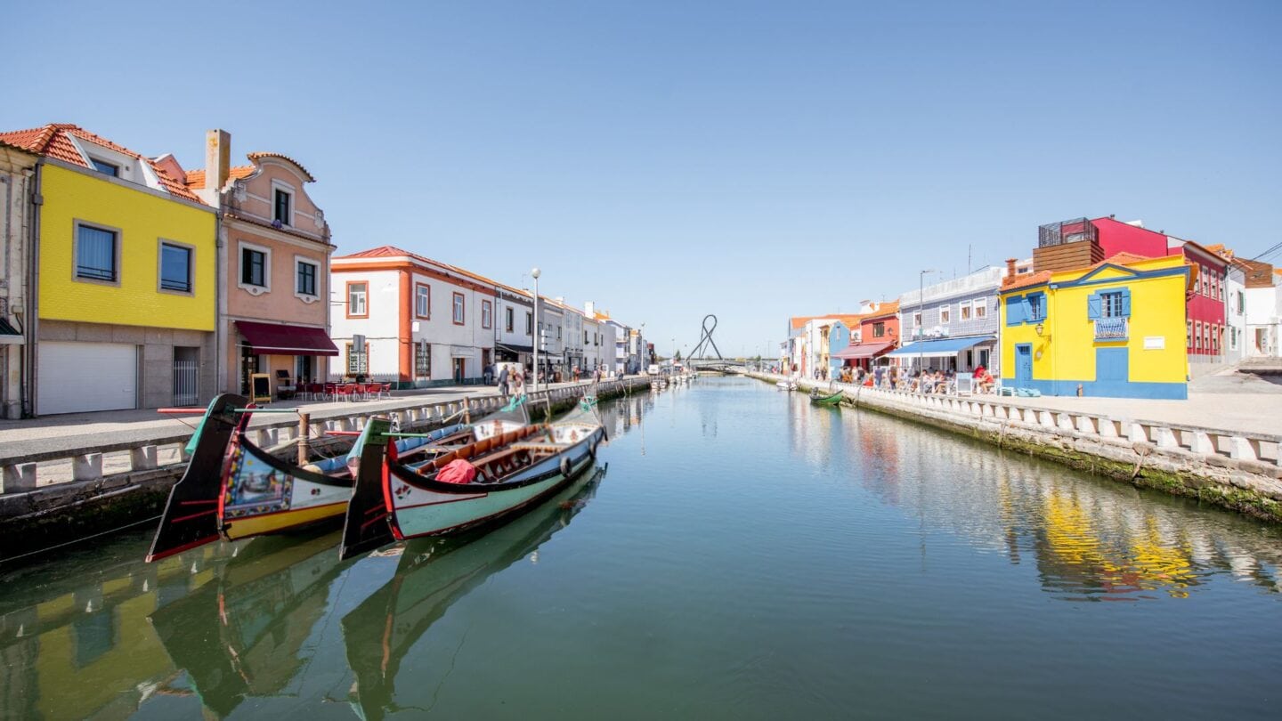 <p>Known as the “Venice of Portugal,” Aveiro is a delightful coastal town with canals and bright-colored buildings. Here, tourists can ride beautiful, vibrant boats, cross traditional bridges, and enjoy a laid-back vibe.</p>