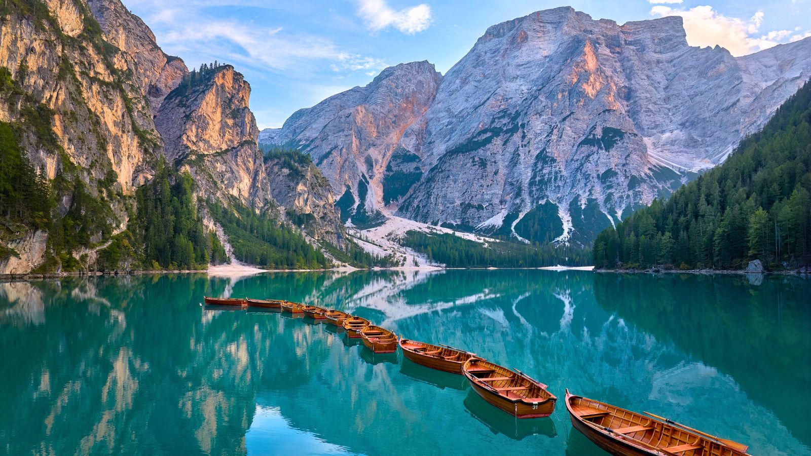 <p><span>On the topic of beautiful lakes, Lake Braies near the Dolomites deserves special mention. It’s not exactly </span><i><span>hidden</span></i><span>, per see.</span></p><p><span>Many tourists visit to see its magical turquoise waters and snowcapped mountains. However, the lake </span><i><span>is</span></i><span> slightly off-the-beaten path. To get there, you have to visit the far northeast of Italy, close to the Austrian border.</span></p>
