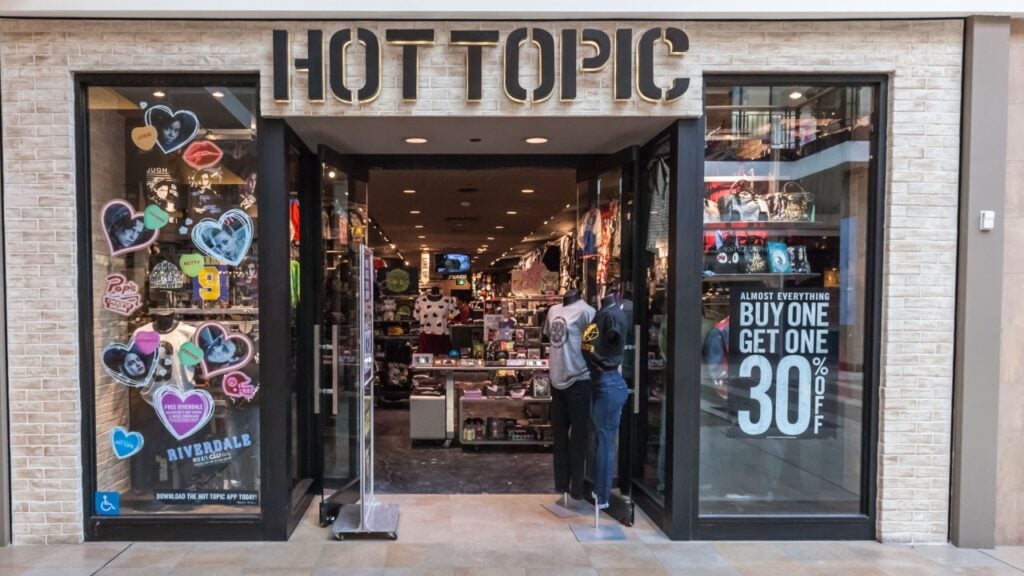 <p>Hot Topic started in 1989 and was the first store to bring alternative apparel and accessories to malls across the U.S. The store has officially licensed merchandise and clothing, from band tees to anime merchandise. Their merch was in especially high demand during the emo fashion trend of the 2000s. However, some not-so-hot things happened, too. For example, <a href="https://www.medcitybeat.com/news-blog/2021/hot-topic-closes-temporarily-closes-store-worker-walkout#gsc.tab=0">in 2021</a>, workers at the Hot Topic store in Rochester, Minnesota, protested low wages and poor working conditions by walking out.</p>
