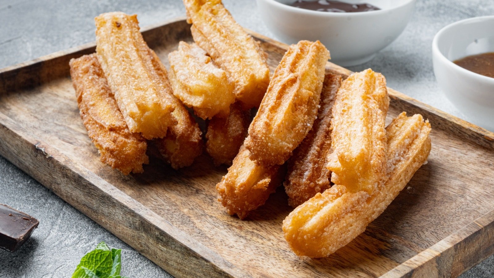 <p><span>Moving on to Spain, churros are a staple street food that can be found in almost every Spanish city. These fried dough pastries coated in sugar and cinnamon are often served with hot chocolate for dipping, making them the perfect indulgent snack.</span></p><p><span>Churros are a testament to Spain’s penchant for comfort food – simple yet delightful. Whether it’s a chilly morning or a late-night craving, nothing hits the spot quite like these warm, crispy pastries generously dipped in rich, velvety hot chocolate. It’s not just a snack; it’s a treat that brings the essence of Spanish hospitality right to your tastebuds.</span></p>