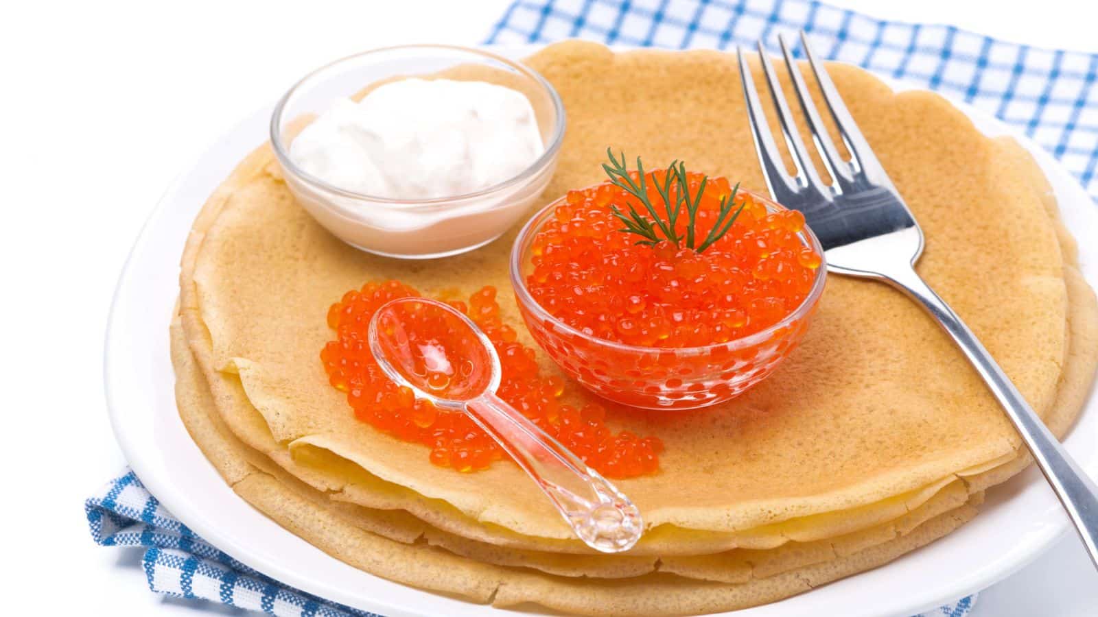 <p><span>Blini are thin and savory pancakes made from buckwheat flour. They’re often topped with various foods such as caviar, smoked salmon, or sour cream. Blini is a popular street food in Russia and is often enjoyed as a quick and tasty snack.</span></p><p><span>Blini are not merely a culinary delight; they’re a symbol of Russian culture and tradition. Each savory pancake rolled meticulously with diverse fillings mirrors Russia’s vibrant heritage and its rich food history. </span></p>