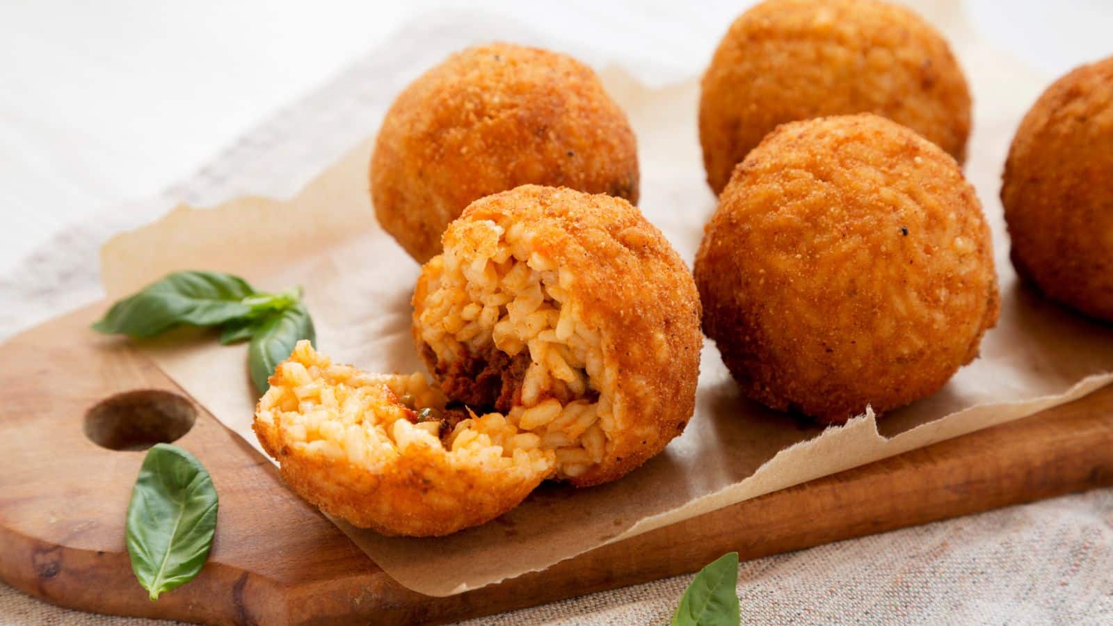 <p><span>Arancini are fried rice balls stuffed with cheese, meat, or vegetable fillings. They originated in Sicily but can now be found throughout Italy. They are often sold as quick and filling street food. These crispy and flavorful snacks are perfect for on-the-go eating.</span></p><p><span>The beauty of arancini lies not only in its satisfying crunch and the burst of flavors with each bite but also in how it represents Italy’s resourcefulness and creativity in food. The next time you find yourself in Italy, make sure to grab an arancini or two. </span></p>