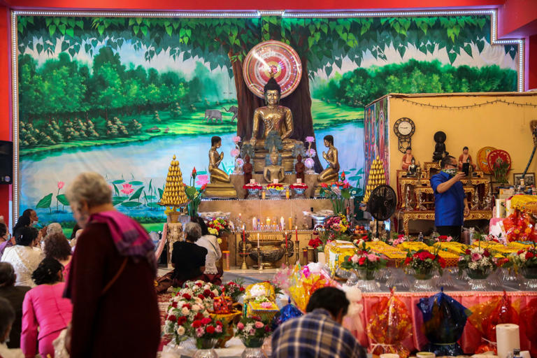 People gather in the monastery during the Kathina Ceremony at Wat Khmer Palelai in Philadelphia, Pa. on Sunday, Oct. 4, 2020. During the Kathina ceremony, lay Buddhists make offerings to the Buddhist monks. The construction of the new temple was funded by donations.