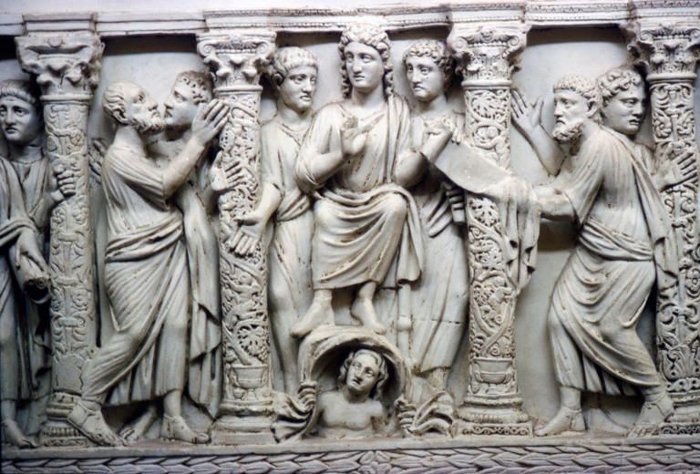 Christ handing scrolll of new law to St Peter while looking at St Paul, mid-4th century. Marble Sarcophagus at Vatican Museums. Artist Unknown.