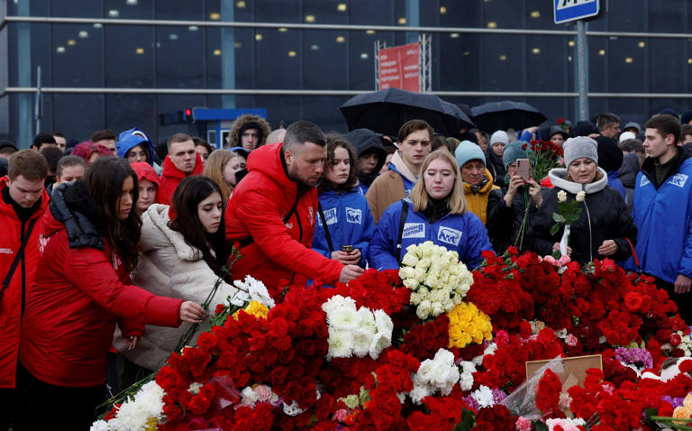 Moscow residents lay flowers in memory of the victims of the Crocus City Hall attack - Maxim Shemetov/Reuters