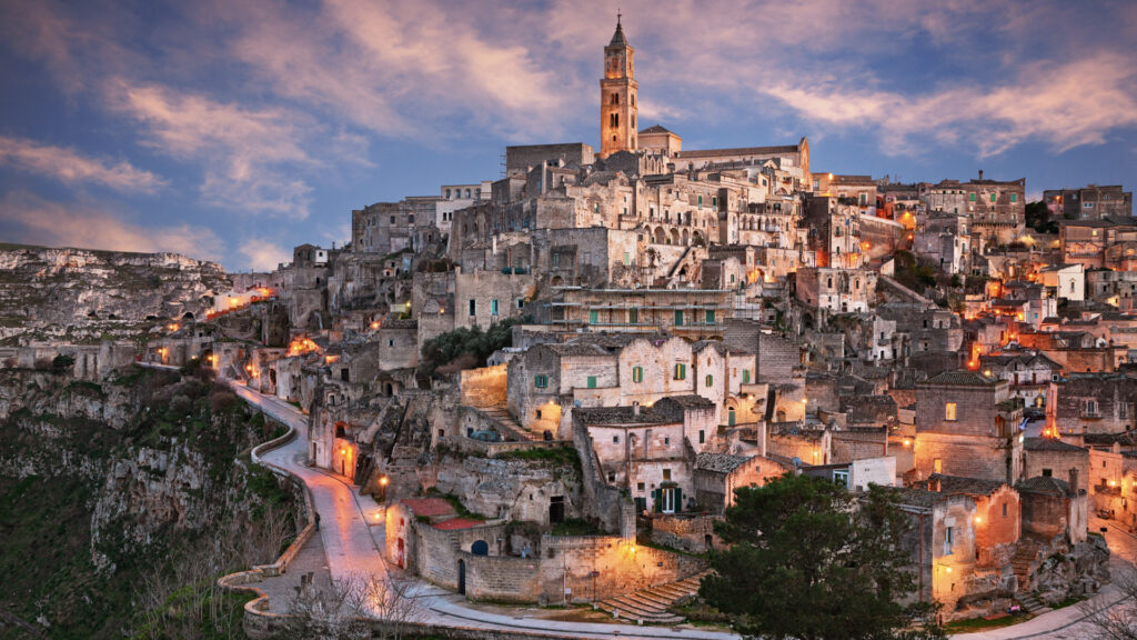 <p>Matera, an ancient city in Southern Italy known as ‘the underground city,’ features unique houses carved into rocks, which were lived in up until the 1950s. Now a UNESCO World Heritage Site, Matera has lost its reputation as ‘Italy’s shame’ to become a remarkable tourist destination. </p><p>Visitors can explore its historic streets, marvel at the ancient cave dwellings, and even stay in modern hotels converted from these caves, offering an unparalleled experience. The transformation of Matera from a place of neglect to a symbol of cultural and architectural wonder showcases the city’s rich history and resilience.</p>
