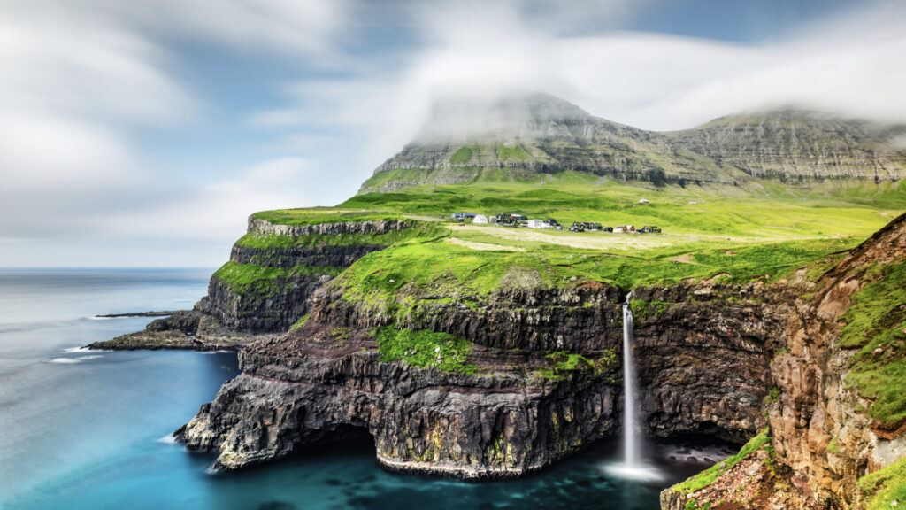 <p>The Faroe Islands are where it’s at for a real off-the-beaten-path adventure. Imagine a spot halfway between Norway and Iceland, bursting with raw nature and Nordic charm. Picture quaint villages, winding roads through lush landscapes, and cliffs that dive straight into the Atlantic. </p><p>In Tórshavn, the capital, you have this cozy historic center with cobbled streets and turf-roofed houses serving unique dishes like fermented mutton. And if you’re into the Northern Lights, this place is a quiet alternative to the usual spots. The folklore here is fascinating, with stories of Vikings and hidden people. Getting here is a bit pricey, but it is worth it for the tranquility and unique vibes.</p>
