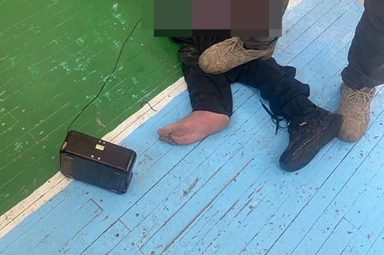 Russian security forces accused of torturing Crocus City Mall terrorist attack suspect, as leaked picture shows a man identified as Shamsuddin Fariddun with wires connected to his groin and his mouth foaming as he grits his teeth in pain