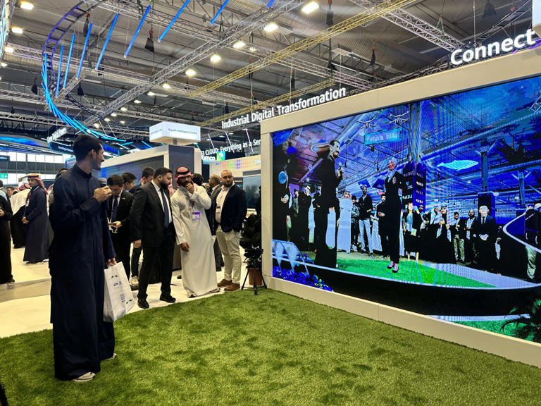 Visitors sample displays at Huawei's booth at the Riyadh Front Expo Centre in Saudi Arabia on February 6, 2023. Photo: Natalie Wong