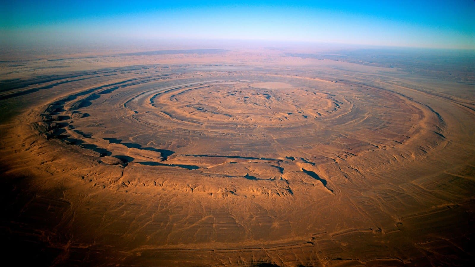 <p class="wp-caption-text">Image Credit: Shutterstock / Som Thapa Magar</p>  <p><span>The Richat Structure, also known as the Eye of the Sahara, is a prominent circular feature in the Sahara Desert that has fascinated Atlantis seekers. Visible from space, this geological formation was once thought to be a crater but is now understood to be the result of erosion. Its circular pattern and size have led some to speculate that it could be the remains of Atlantis, described by Plato as being concentric rings of land and water.</span></p>