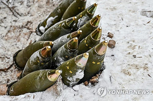 This file photo, released by Reuters, shows 155 mm artillery shells at a position ready for use by Ukrainian servicemen near a front line amid Russia's attack on Ukraine on Jan. 14, 2024. (Yonhap)