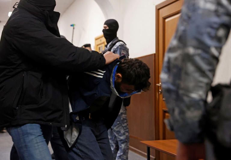 Moscow attack suspects appear in court, swollen faces showing signs of ...