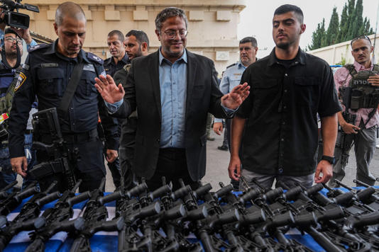 Israel's National Security Minister Itamar Ben-Gvir attends an event to deliver weapons to local volunteer security group members in Ashkelon, Israel on Friday, Oct. 27, 2023. (Tsafrir Abayov/The Associated Press)