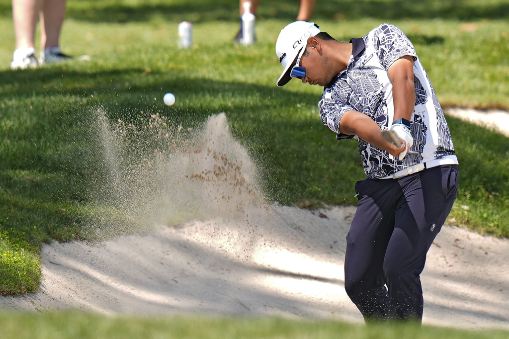 <p>Ryo Hisatsune, of Japan, hits from the sand trap on the fifth hole during the third round of the Valspar Championship golf tournament Saturday, March 23, 2024, at Innisbrook in Palm Harbor, Fla. </p>