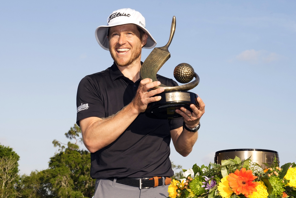 <p>Peter Malnati holds up the trophy after winning the Valspar Championship golf tournament Sunday, March 24, 2024, at Innisbrook in Palm Harbor, Fla. </p>