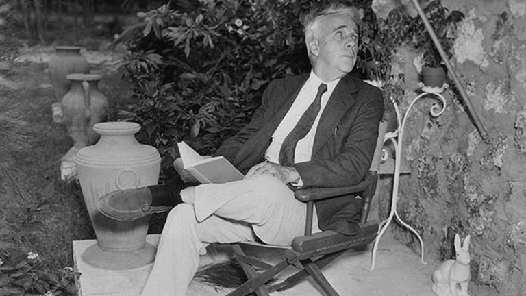 Robert Frost Sitting with Book in Hand