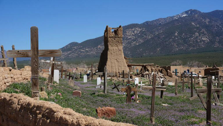 The Taos Pueblo Cemetery with original San Geronimo Church in the background in Taos, N.M., on Sunday, April 16, 2023. Taos Pueblo is the only living Native American community designated both a World Heritage Site by UNESCO and a National Historic Landmark.