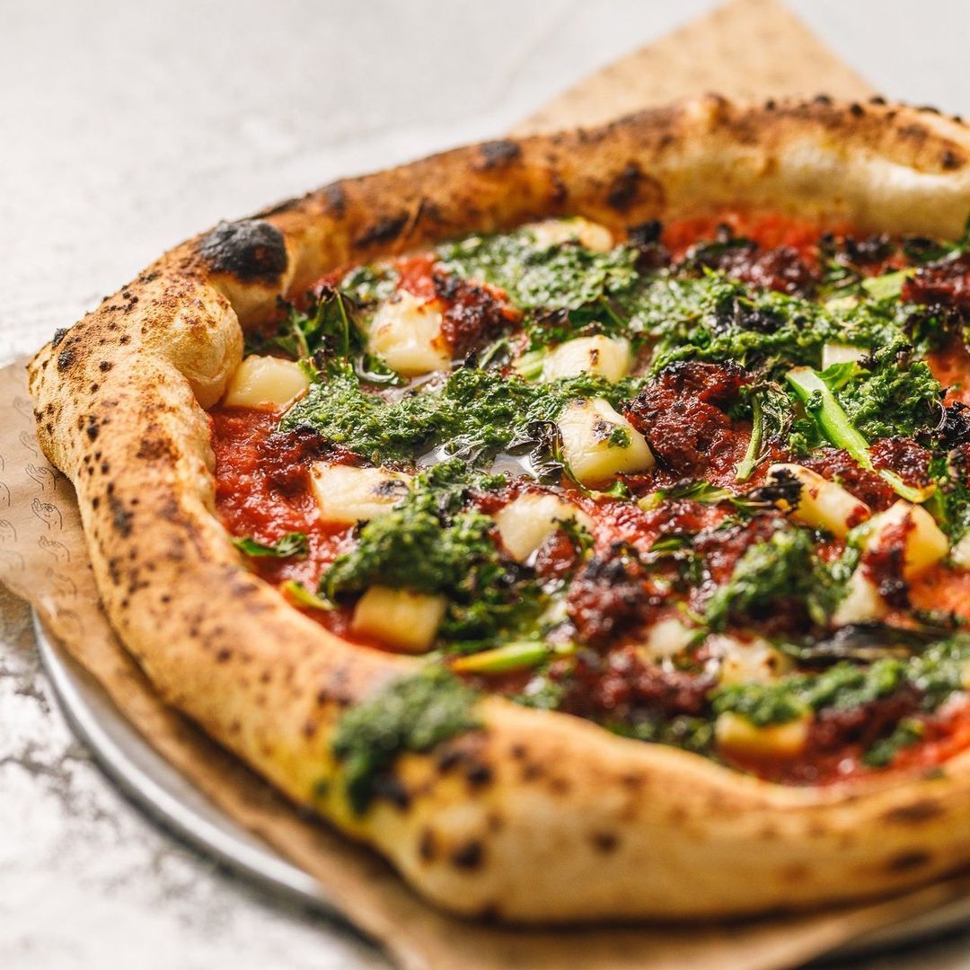 <p>When you’re craving handmade sourdough pizzas in Bristol, heading to <a href="https://www.pizzarova.com" title="https://www.pizzarova.com">Pizzarova</a> is the answer. Not only is the hot spot <a href="https://www.tripadvisor.com/Restaurant_Review-g186220-d15131275-Reviews-Pizzarova-Bristol_England.html" title="https://www.tripadvisor.com/Restaurant_Review-g186220-d15131275-Reviews-Pizzarova-Bristol_England.html">highly rated on TripAdvisor</a> but it also has an excellent <a href="https://www.opentable.co.uk/r/pizzarova-park-street-bristol" title="https://www.opentable.co.uk/r/pizzarova-park-street-bristol">rating on Open Table</a>. The restaurant started life as a “Land Rover fitted with a mobile pizza oven,” but now has two additional locations, neither of which have wheels. </p>