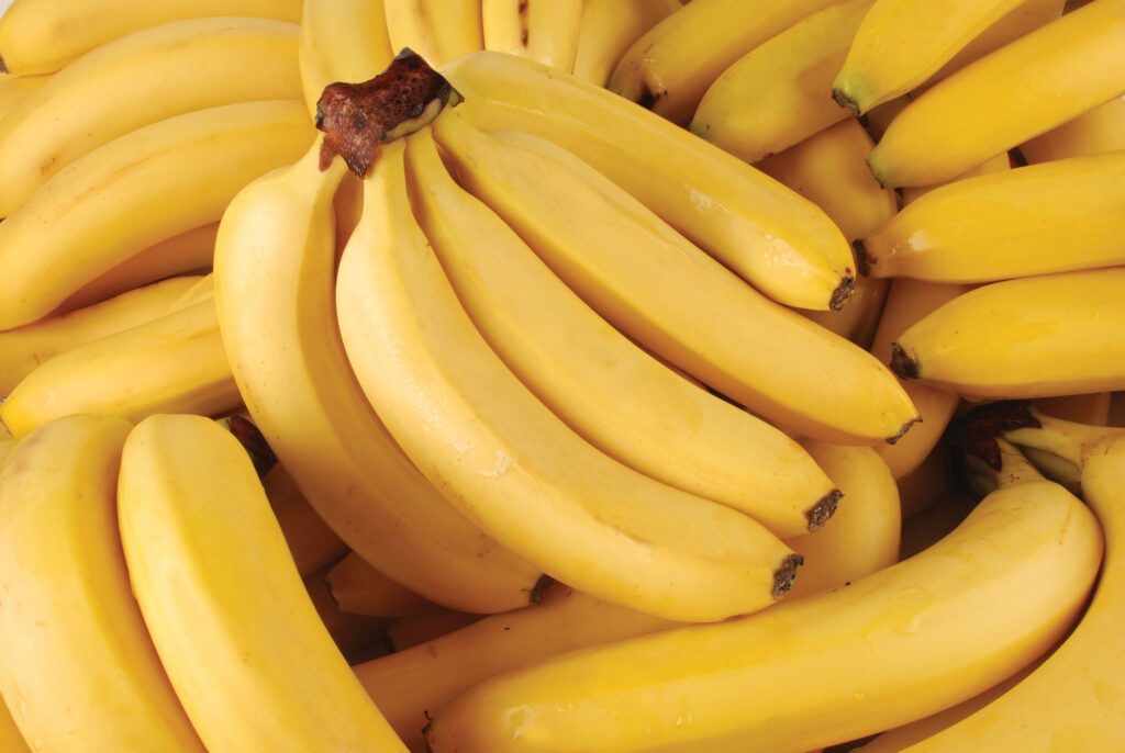 <p>Keep bananas from ripening too quickly by separating them and covering the stems with plastic wrap.</p>