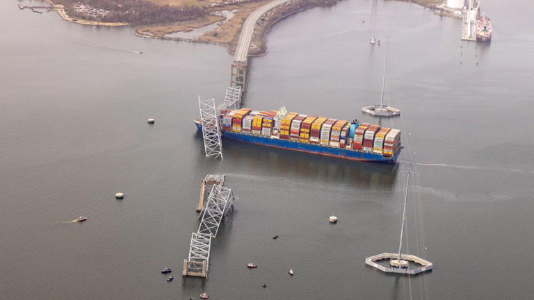 The cargo ship Dali is seen after running into and collapsing the Francis Scott Key Bridge on March 26, 2024 in Baltimore, Maryland. Rescuers are searching for at least seven people, authorities say, while two others have been pulled from the Patapsco River. - Tasos Katopodis/Getty Images