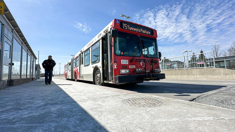 An OC Transpo bus pulls up to a stop on Monday. The transit system will see a major overhaul when the Trillium Line returns, which is expected in spring or summer.