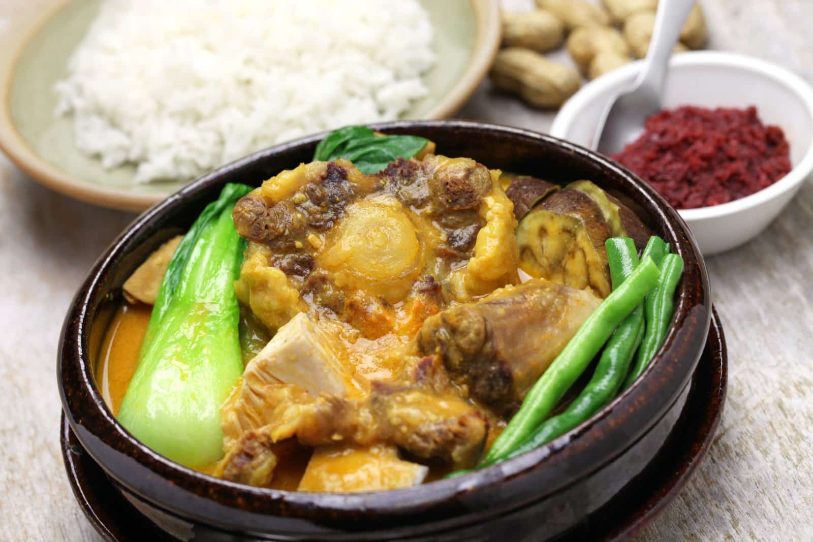 <p class="wp-caption-text">Image Credit: Shutterstock / bonchan</p>  <p><span>Filipino cuisine is a melting pot of influences, blending indigenous, Spanish, Chinese, and American culinary traditions. The result is a unique flavor profile that balances sweet, sour, and salty. Dishes such as Adobo, a marinated meat stew, and Sinigang, a sour soup, exemplify the cuisine’s complex flavors. Rice is a staple, served alongside a variety of dishes at every meal.</span></p>