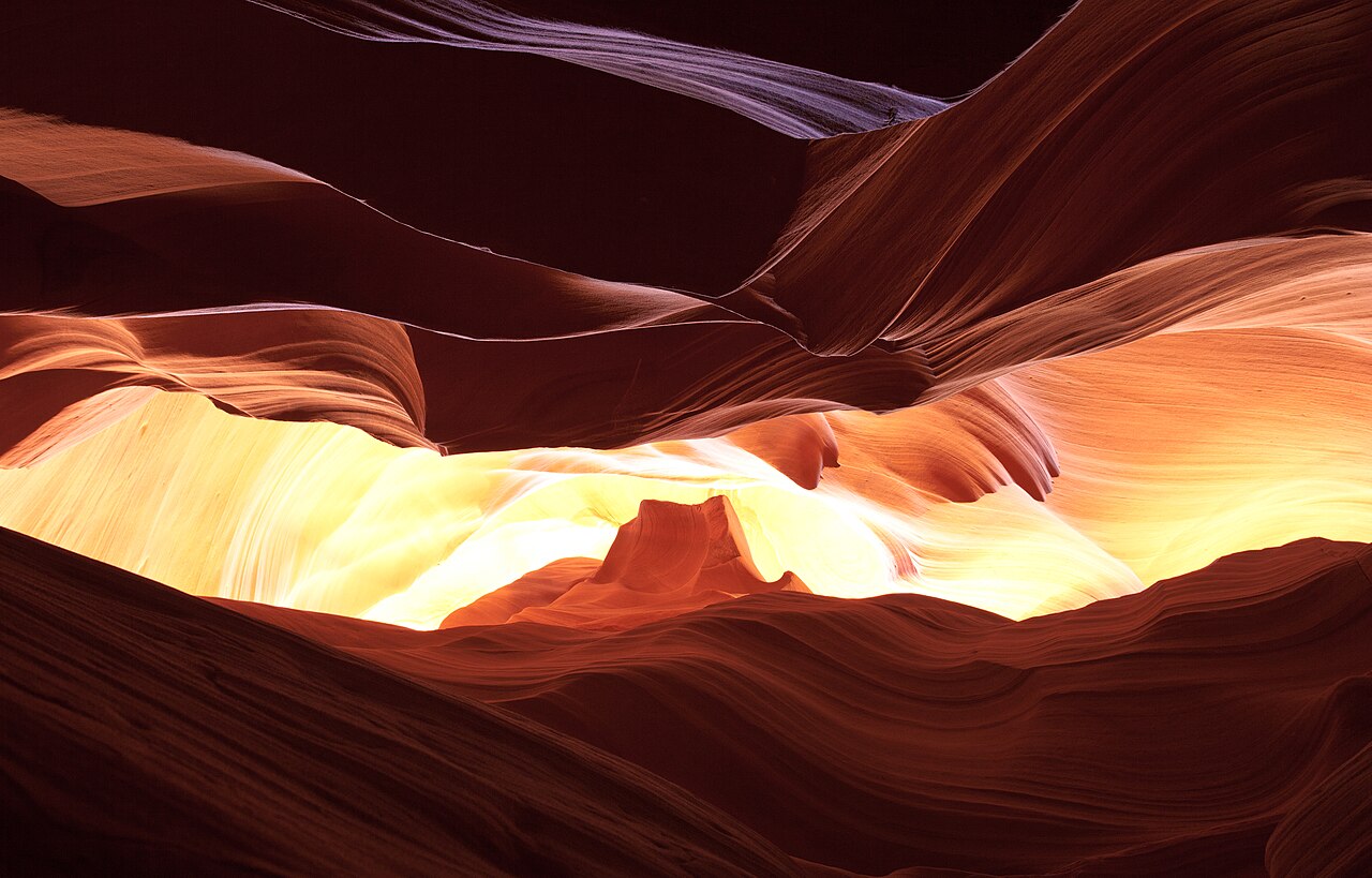 Located within the Glen Canyon National Recreation Area, Antelope Canyon offers visitors a glimpse into the natural forces that have shaped the landscape over millennia. Its narrow passageways and towering walls, adorned with vibrant hues of red and orange, provide a mesmerizing backdrop for photographers and adventurers.