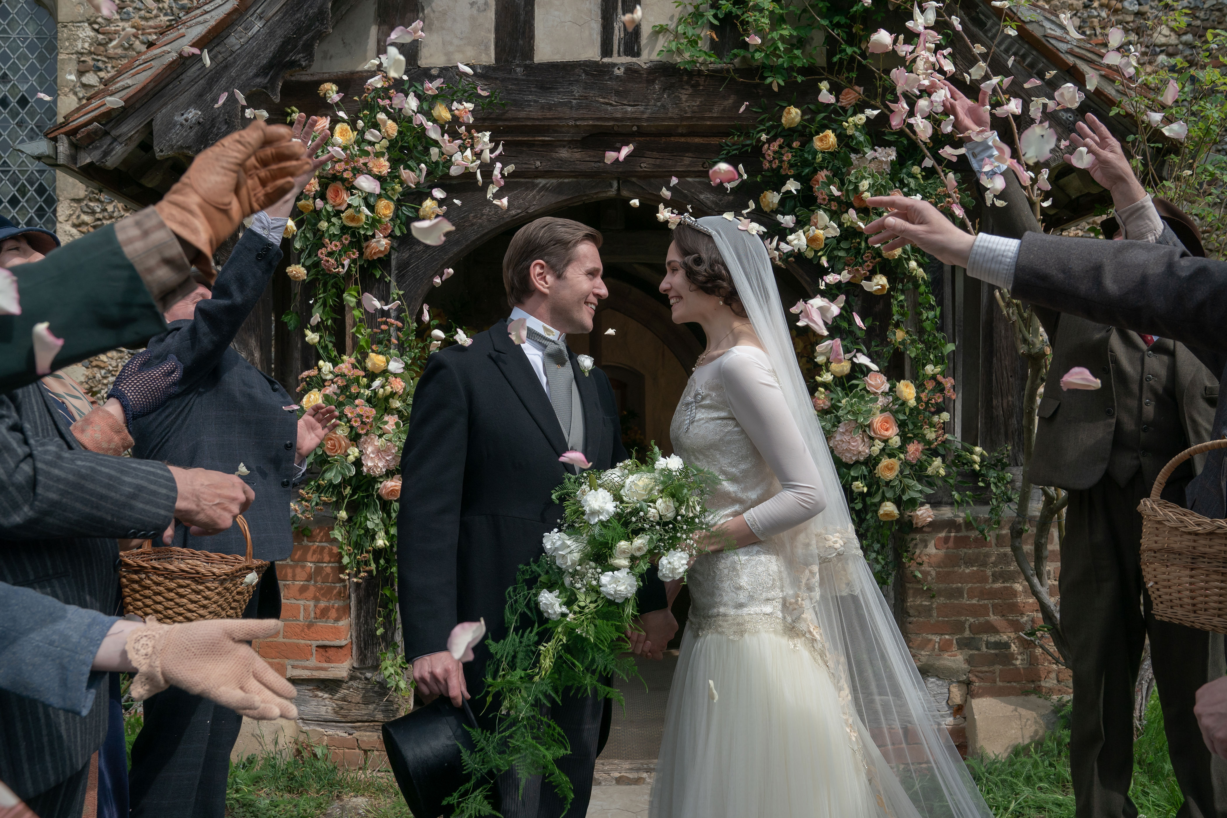 <p>Allen Leech donned a morning suit as his character, Tom Branson, wed Tuppence Middleton's Lucy Smith -- who wore a beautiful drop-waist wedding gown -- in the 1928-set 2022 film "Downton Abbey: A New Era."</p>