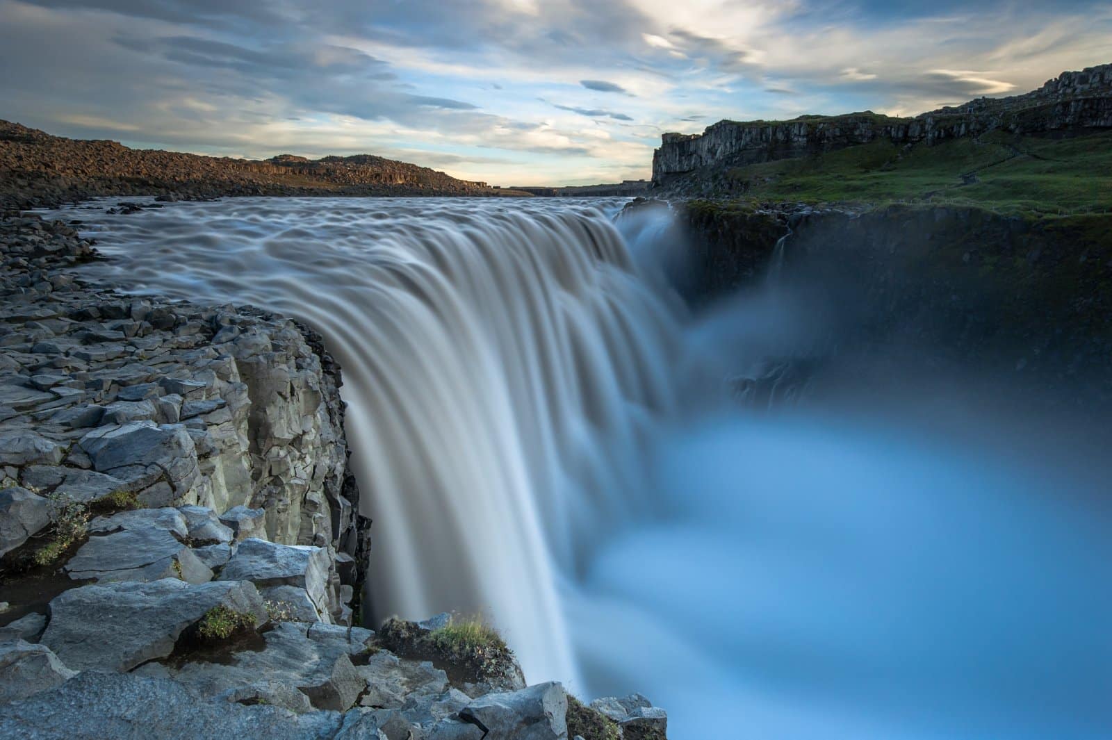 <p class="wp-caption-text">Image Credit: Shutterstock / Thomas Lusth</p>  <p><span>Dettifoss, located in Vatnajökull National Park in Northeast Iceland, is reputed to be the most powerful waterfall in Europe. The waterfall’s sheer force and the volume of water cascading down into the Jökulsárgljúfur canyon make it a breathtaking sight. The surrounding landscape, characterized by rugged terrain and the stark beauty of the Icelandic highlands, adds to the waterfall’s dramatic appeal.</span></p>