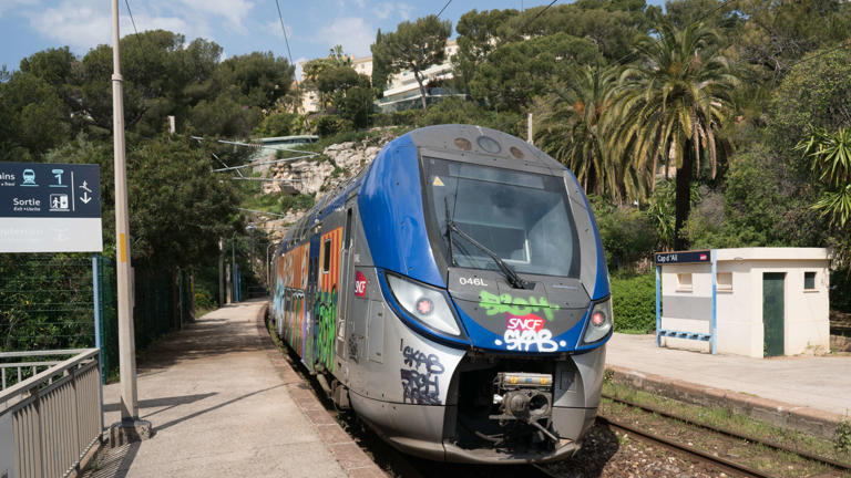 A Transport Express Regional (TER) train, operated by French national railway operator Societe Nationale des Chemins de Fer (SNCF), stands at a platform at Cap d'Ail railway station during continuing strike action in Cap-d'Ail, France, on Wednesday, April 18, 2018. French unions are spearheading a series of two-day strikes every week through June to protest the government's plans to end for new recruits the privileges railworkers have long enjoyed on job security, early retirement and special pensions. Photographer: Nicolas Enriquez/Bloomberg via Getty Images