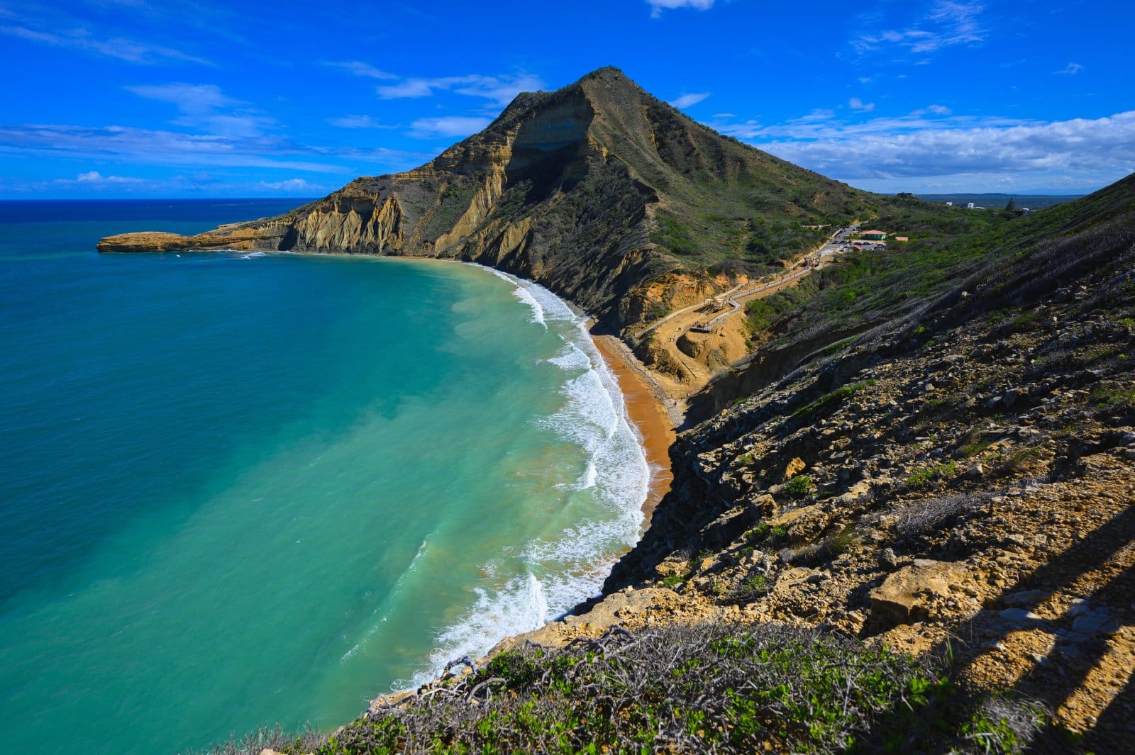 <p class="wp-caption-text">Image Credit: Shutterstock / Aleks Khan</p>  <p><span>Monte Cristi National Park, located northwest of the Dominican Republic, contrasts the country’s more frequented tropical landscapes. Dominated by the iconic El Morro, a sheer limestone cliff that rises dramatically from the sea, the park’s unique topography includes mangrove forests, subtropical dry forests, and saline lagoons. This diverse ecosystem is a haven for birdwatchers, with species such as the American flamingo and the Royal tern making their home here. The underwater landscapes are equally compelling, with coral reefs and sunken ships offering excellent opportunities for snorkeling and diving, providing a glimpse into the marine biodiversity and historical shipwrecks beneath the waves. Monte Cristi’s commitment to preserving its natural and historical assets while promoting eco-friendly tourism allows visitors to explore this unique area responsibly. The park’s relatively remote location ensures that its beaches and natural features remain unspoiled, offering a serene and intimate experience of the Dominican Republic’s natural beauty.</span></p>