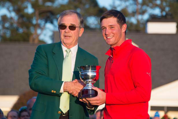 Bryson DeChambeau receives the low amateur trophy from Augusta National chairman Billy Payne at the 2016 Masters.