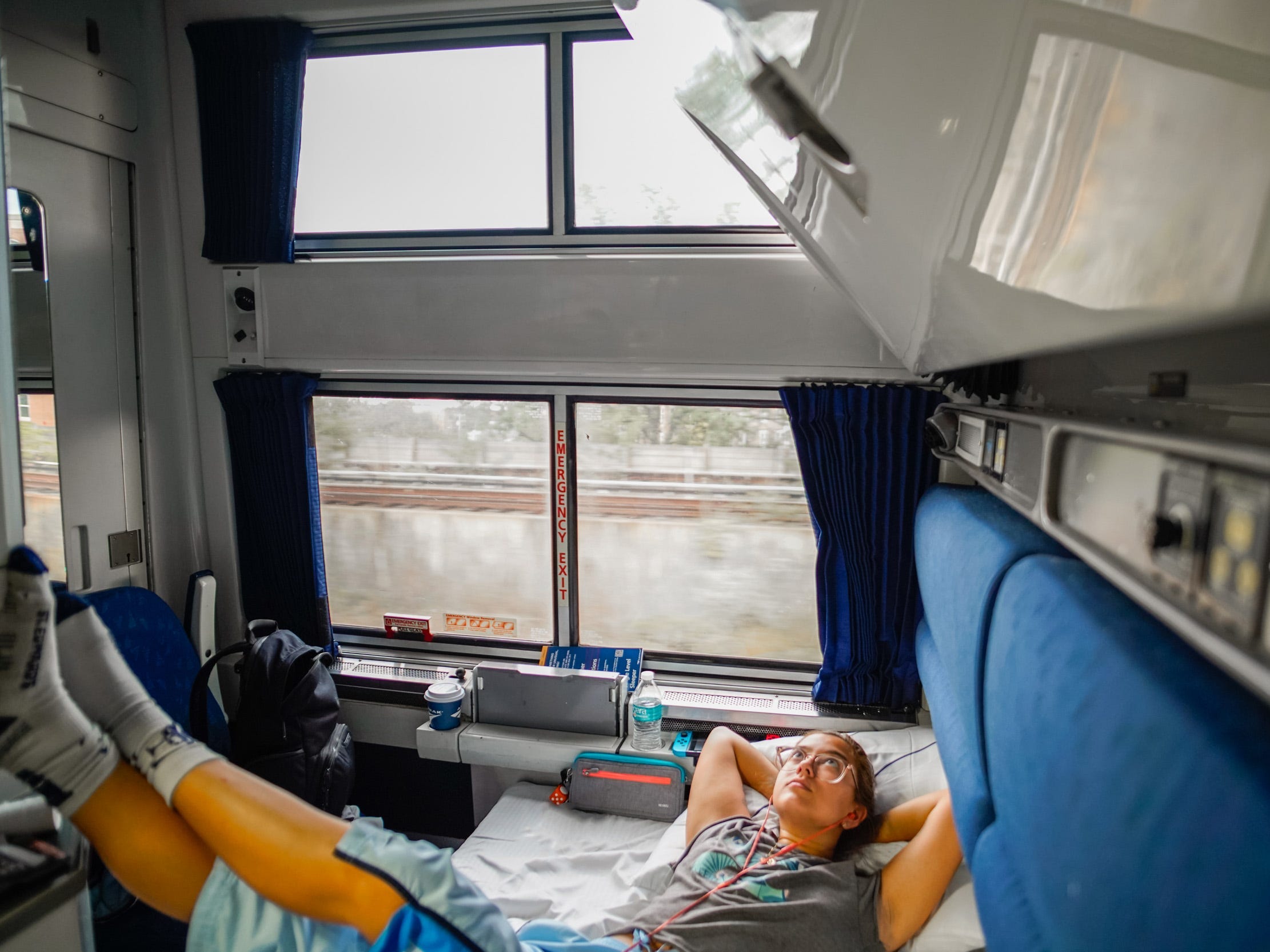 <p>My Amtrak bedroom had a sofa that folded out into a bed, a bunk that pulled down from the ceiling, and a chair that folded up out of the way.</p><p>Two wide windows and a full-length mirror on the wall made the space feel bigger. And even with all the furniture and amenities, there was enough floor space to stand up and stretch my limbs between hours of sitting. </p>