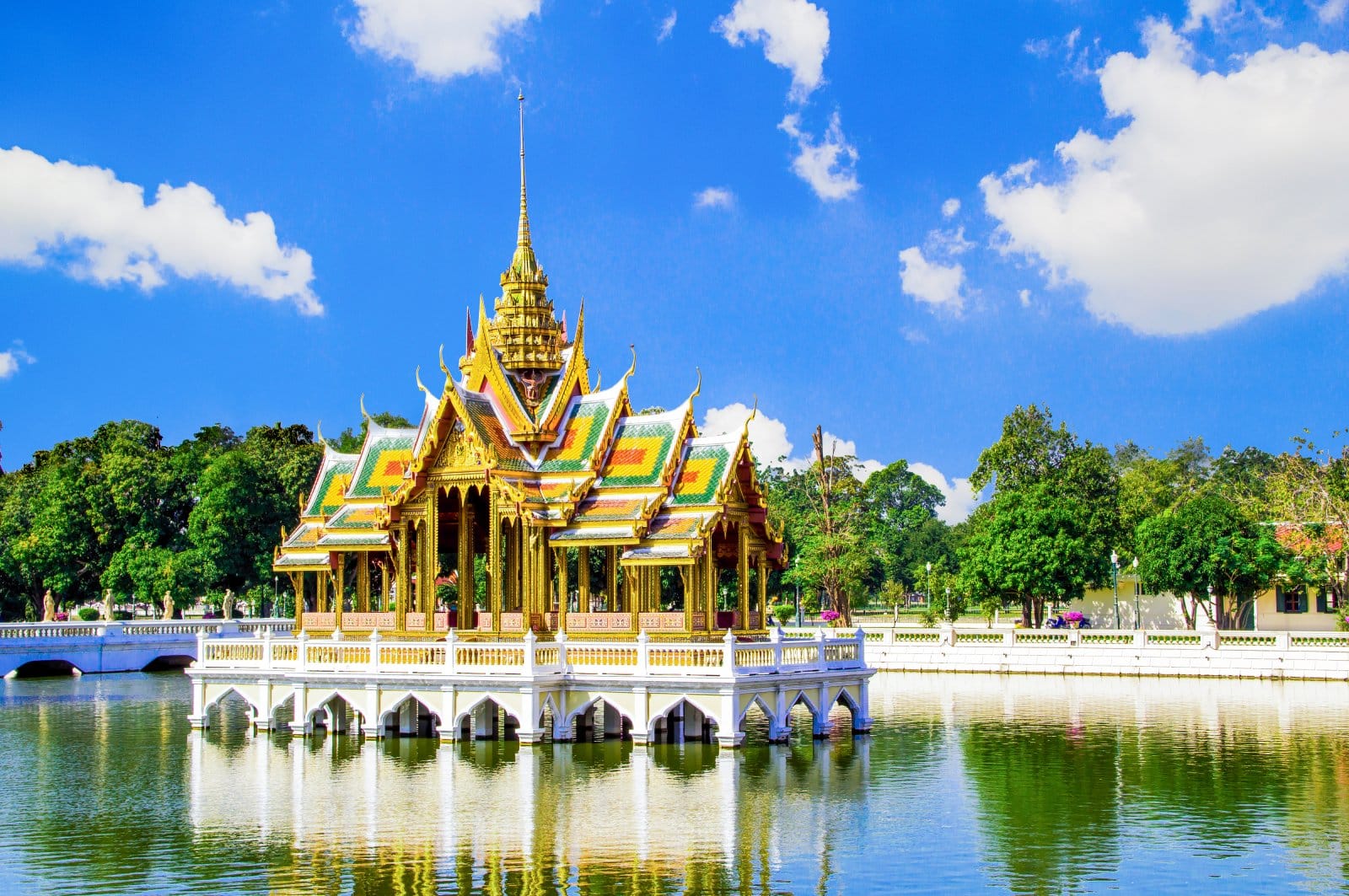 <p class="wp-caption-text">Image Credit: Shutterstock / AofLine</p>  <p>The Royal Summer Palace, Bang Pa-In, highlights Thailand’s royal heritage, blending Thai, Chinese, and Gothic architectural styles since its 17th-century origins and 19th-century expansion by King Chulalongkorn (Rama V). This complex features diverse structures like the traditional Thai Aisawan Thiphya-Art Pavilion and the Chinese-style Wehart Chamrun mansion, surrounded by meticulously designed gardens. These elements reflect the Thai monarchy’s global influences and commitment to cultural preservation amidst modernization. Today, Bang Pa-In serves both as a royal retreat and a cultural attraction, symbolizing Thailand’s rich history and its balance of tradition and modernity.</p>