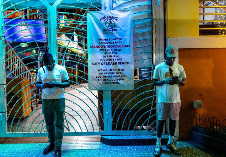 A sign explaining the closure of Mangos Tropical Cafe South Beach all days curfew has been ordered by there city during Spring Break 2024 in Miami Beach, Florida, on Friday, March 15, 2024.