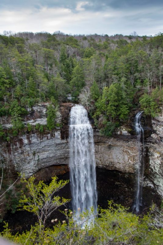 <p>Fall Creek Falls is one of the most stunning sights in the United States, dropping an incredible 256 feet. The <a href="https://www.outdoorrevival.com/travel/unique-texas-state-parks.html" rel="noopener">state park</a> has a lot to offer to those who love the outdoors. In order to see Fall Creek Falls, hikers must first make a three-mile trek, which is just part of the 34 miles of available <a href="https://www.outdoorrevival.com/adventure/beautiful-hiking-trails-america.html" rel="noopener">hiking trails</a>. Visitors can also stay at on-site <a href="https://www.outdoorrevival.com/old-ways/the-history-of-log-cabins-one-of-the-best-survival-shelters.html" rel="noopener">cabins</a> or <a href="https://www.outdoorrevival.com/instant-articles/camping-in-alaska.html" rel="noopener">camp</a> out in the wilderness.</p>