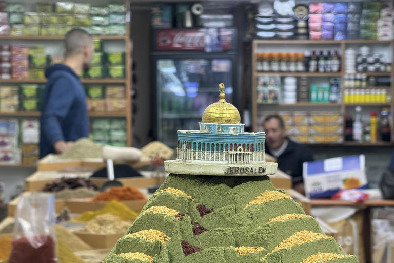 A model of the Dome of the Rock Islamic shrine on top of a pile of spices in a Jerusalem market. The shrine and the Al Aqsa Mosque compound where it stands are not only holy for Muslims, but are also symbols of Palestinian aspiration for statehood. Matthew Tostevin