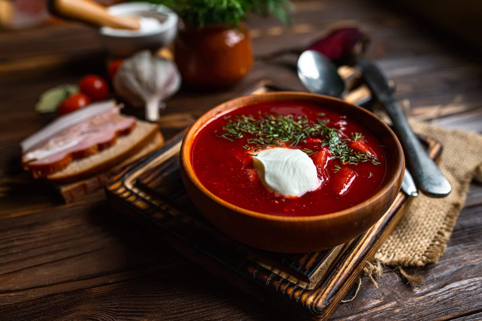 Image Credit: Shutterstock / Lipatova Maryna <p>A beet soup that combines the sweetness of beets with a tangy kick, served hot or cold with a dollop of sour cream.</p>