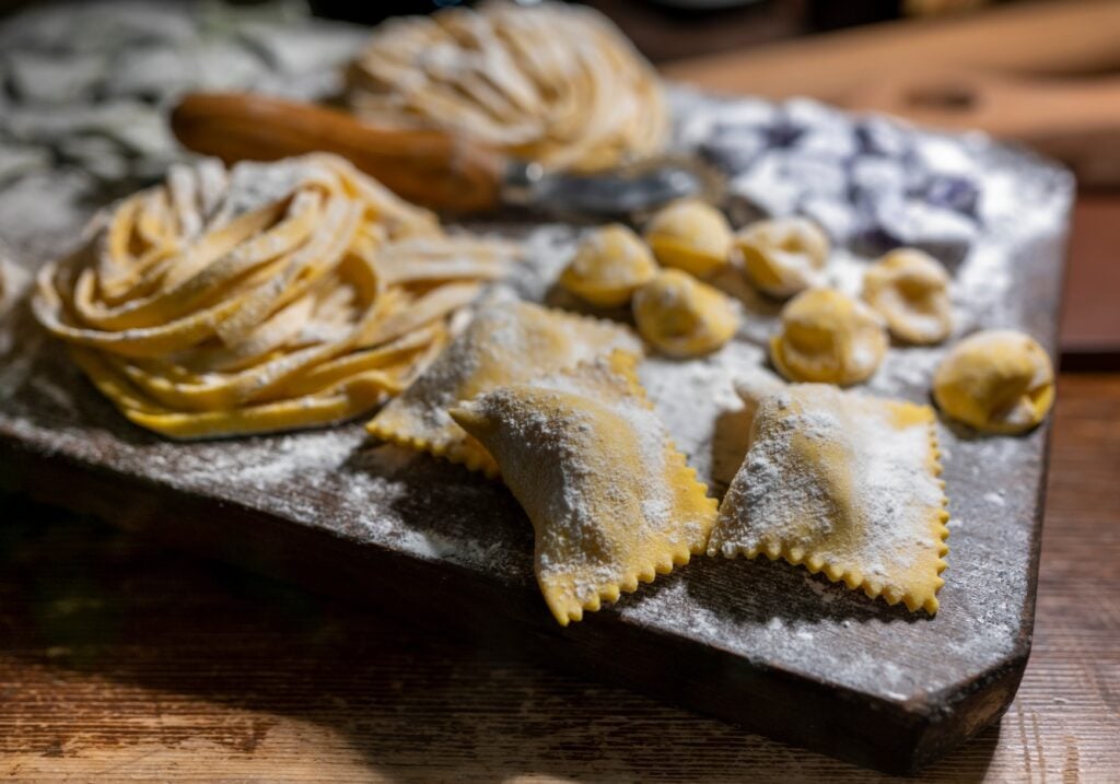 <p class="wp-caption-text">Image credit: Shutterstock / barmalini</p>  <p><span>No visit to Bologna is complete without discovering its culinary arts. Participate in a cooking class at Cucina Bolognese, where you’ll learn to make traditional dishes such as tagliatelle al ragù, tortellini, and other pasta delights. These classes offer hands-on experience guided by local chefs who share secrets passed down through generations. You’ll enjoy the immersion into the heart of Bolognese culture, where food is a language of love and history. Tuck into your creations for a filling lunch.</span></p>