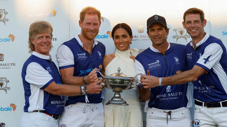 Britain's Prince Harry and Meghan, Duchess of Sussex, pose with other players as they attend the Royal Salute Polo Challenge to benefit Sentebale, a charity founded by him and Prince Seeiso of Lesotho to support children in Lesotho and Botswana, in Wellington, Florida, US on April 12