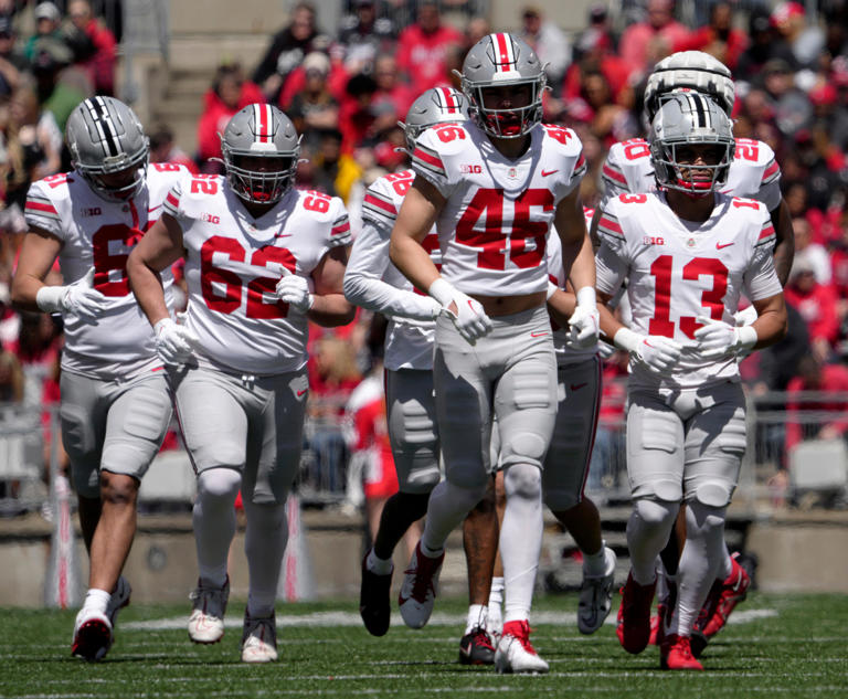 Ohio State defensive end Caden Davis (61), defensive lineman Bryce Pater (62), safety Ryan Rudzinski (46) and cornerback Miles Lockhart (13) at the spring game on April 13.