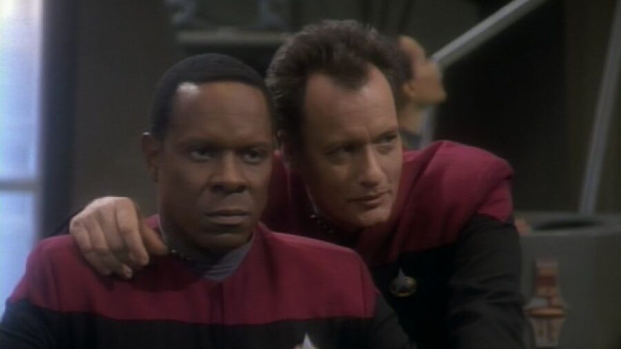 <p>Arguably, though, Q’s one and only Deep Space Nine episode makes Lwaxana’s episode look like high art: the episode “Q-Less” has the impish alien appear on the space station in the company of Vash, Captain Picard’s one-time love interest who ran away with the powerful alien at the end of The Next Generation episode “Qpid.” The fan-favorite antagonist alien was literally only added to this episode to show how different the DS9 characters were from their TNG counterparts. However, I contend that we didn’t need to see Sisko punch Q out and angrily state, “I’m not Picard,” to know how different he was from the captain of the Enterprise.</p>