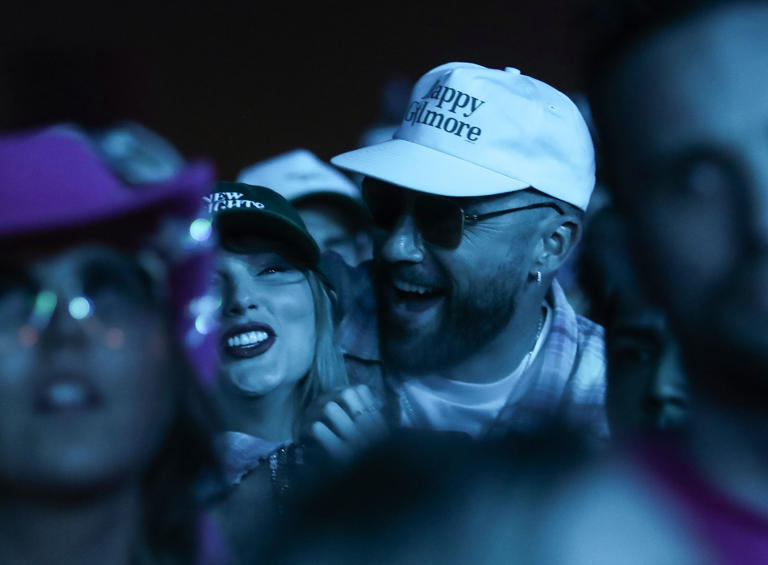 Taylor Swift and Travis KeIce watch as Ice Spice performs in the Sahara tent at the Coachella Valley Music and Arts Festival in Indio, Calif., April 13, 2024.