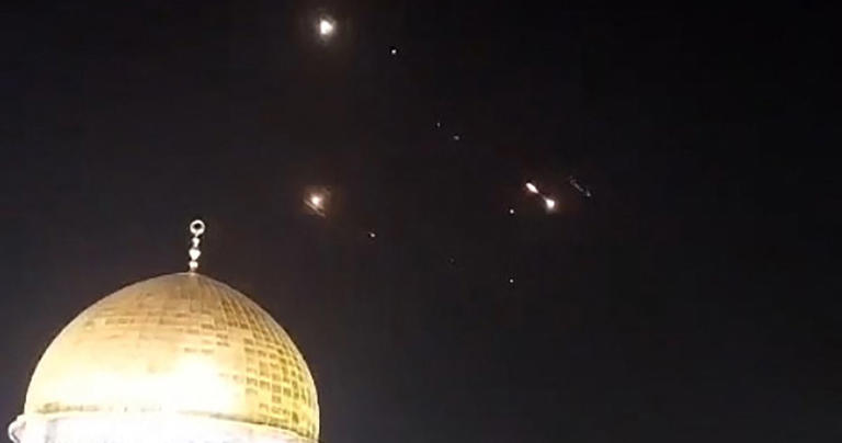 An image-grab from a video taken early on Sunday shows rocket trails in the sky above the Al-Aqsa Mosque compound in Jerusalem. Screencap/AFP via Getty Images
